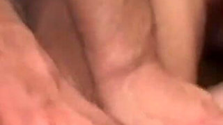 Redhead sucks two cocks in threesome and gets a warm load on her tits