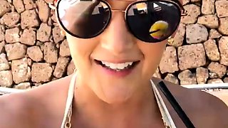 Blonde is flashing her big boobs in the outdoors