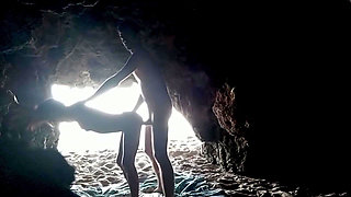 Couple recorded at the beach, inside the cave