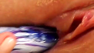 Oiled Blonde Stretches Her Pussy with a Thick Glass Dildo
