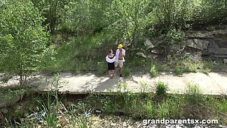 Blond mature enjoys outdoor threesome with passionate blowjob