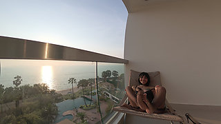 Cute Asian in Black Lace Lingerie Sways Hips on Oceanfront Balcony