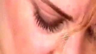 She Lies Naked on the Beach While He Watches Her