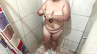Sexy girl takes a shower in a motel bathroom and touches her tits and ass very rich.