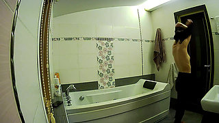 Stella Prepares to Take a Bath in the Bathroom - Real Amateur Voyeur Scene