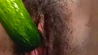 Teen college girl masterbating using cucumber