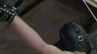 Dominating chaining whipping masked guy