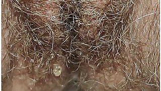 Best close-up of peeing on a thick, hairy pussy