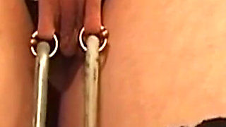Chained Mature Brunette MILF Endures Nipple Weights and Spanking