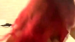 Amateur redhead poses and masturbates with toys