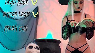 A blond doll in a witch hat and black with cum