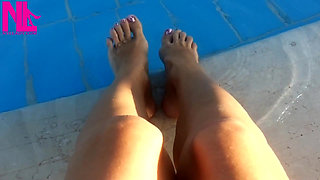 Barefoot Dangling in Swimming Pool Water