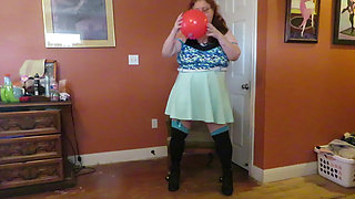 Nurse Vicki  plays with a rubber ball in a mini skirt, sexy stockings and high heel mini boots