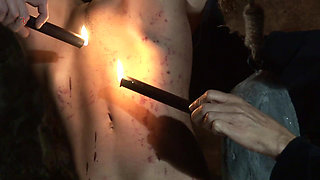 Witch Hangs Upside Down and Gets Drizzled with Black Wax