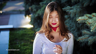 Sultry Russian Girl Smoking Cigarette by Waves