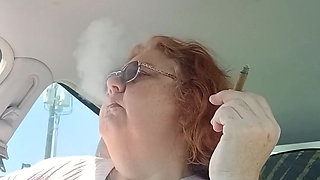 BBW smoking in pink sweater in her car talking to her fans