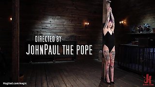 Tattooed slave bound to wooden column