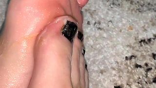 Playing with my feet with a body oil and cream