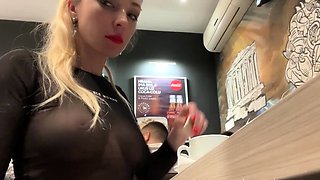 Flashing her big boobs in transparent top in public cafe.