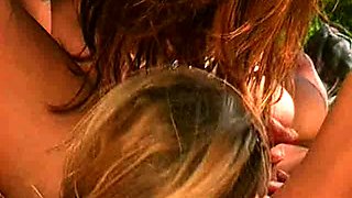 Tattooed up milf sucks and slurps on a big cock outdoors