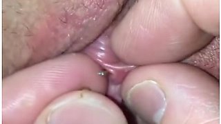 Close Up View Of Her Clit Piercing Jewelry Insertion