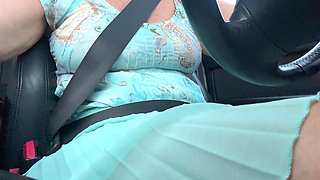 An elegant lady drives to work and rubs her pussy with her hand between her hot thighs