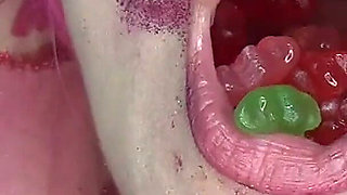 Evil Sexy Clown Swallows Hundreds of Gummy Bears!!