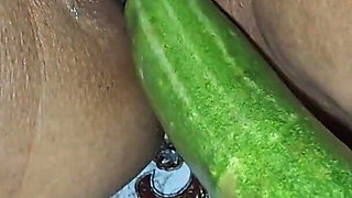 A Long, Thick Cucumber in a Hot Desi Bhabhi's Hot Pussy.