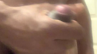 Hand jobbing a stiff cock