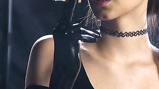 Brunette Smoking in Black Latex Outfit Slow Sensual Scene