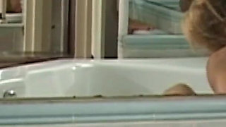 Mature Blonde MILF Julia Rides Red Dildo in Bathtub