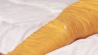 A Cute Barefoot Girlfriend Uses Tape to Bind Her Whole Body, Playing with Her Cute Bare Feet