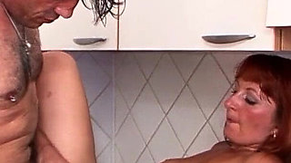 Ginger MILF with hairy pussy lets husband fuck her in the kitchen