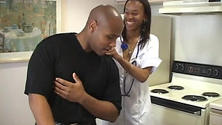 Hot black nurse gets her pussy slammed on the table