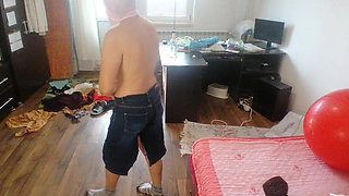 Amateur woman has fun trying on clothes and cutting them.