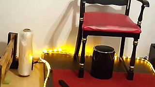 Curvy Brunette Dominatrix Commands Bound Slave in Fetish Dungeon