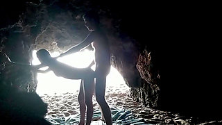 Couple recorded at the beach, inside the cave