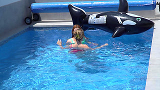 Lesbian Girls Are Having Fun in a Pool with an Inflatable Shark