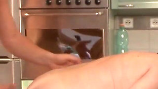 Grandma fucked by the horny neighbor boy in the kitchen