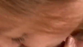 Brunette and blonde kiss and lick each other