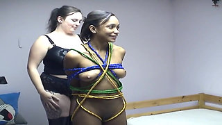 Mature Babe Tied Tight in Colorful Ropes by Dominant Friend